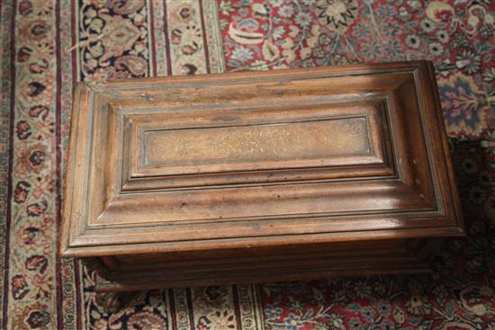 A small Italian marquetry inlaid walnut cassone, W.2ft 5in. D.1ft 2in. H.1ft 3in.
